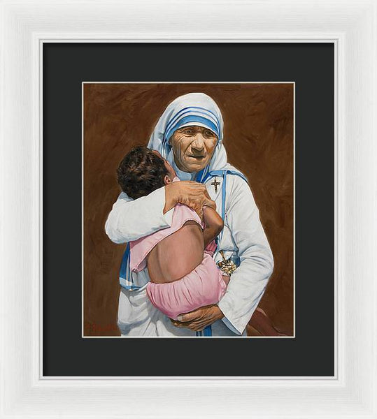 Mother Teresa holding a child - Framed Print