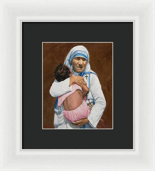 Mother Teresa holding a child - Framed Print
