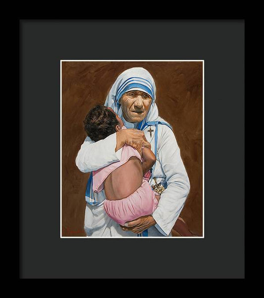 Mother Teresa holding a child - Framed Print