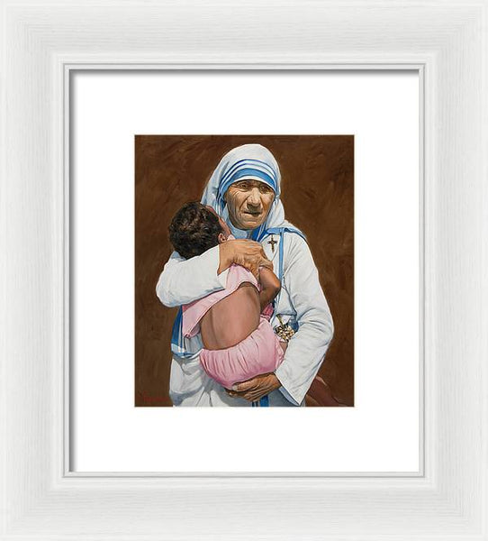 Mother Teresa holding a child - Framed Print