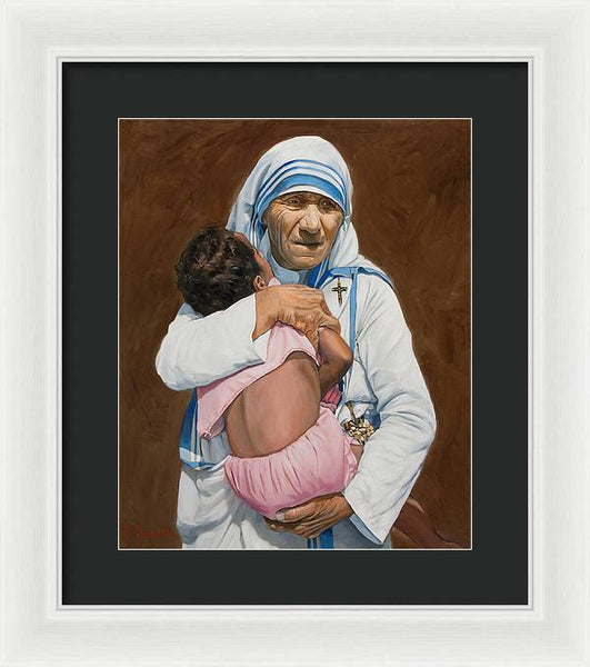 Mother Teresa holding a child - Framed Print