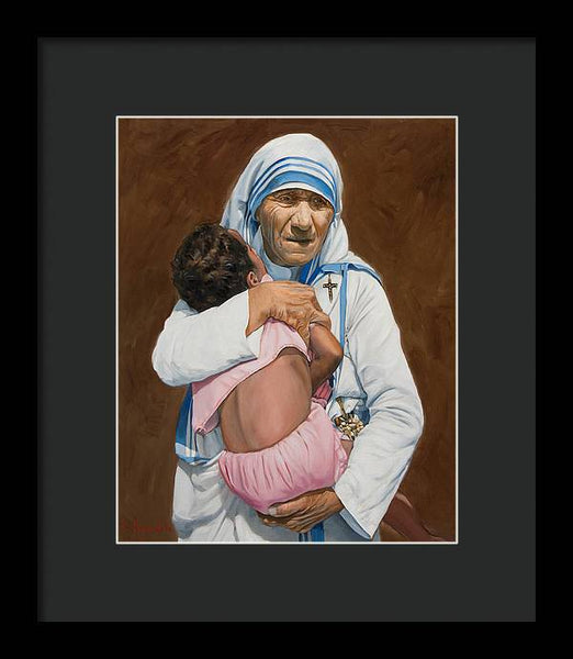 Mother Teresa holding a child - Framed Print