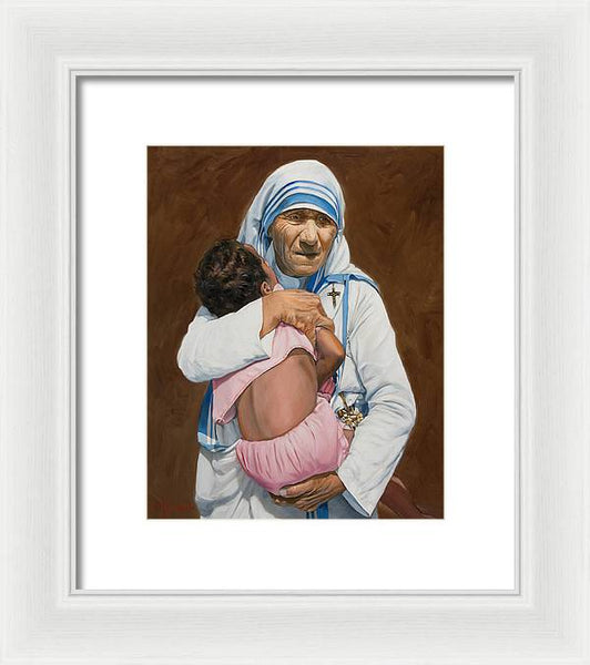 Mother Teresa holding a child - Framed Print