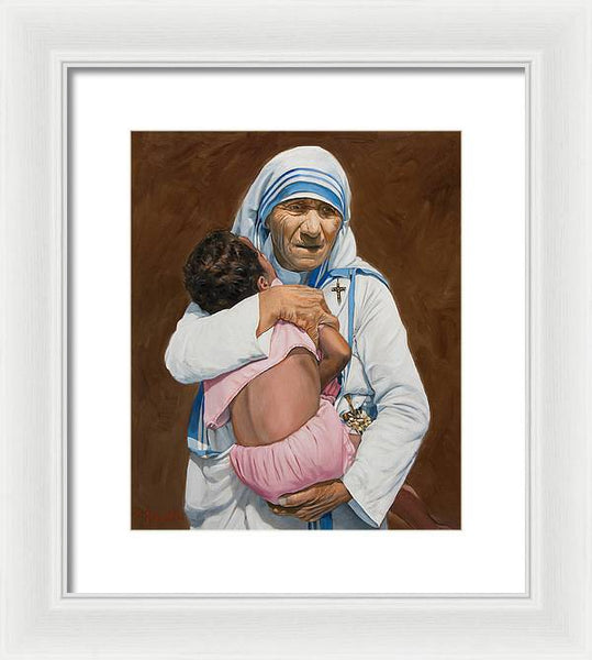 Mother Teresa holding a child - Framed Print