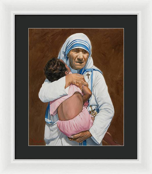 Mother Teresa holding a child - Framed Print