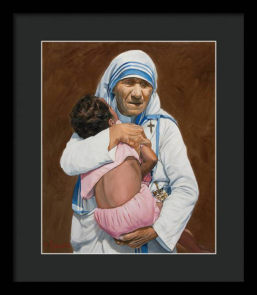 Mother Teresa holding a child - Framed Print