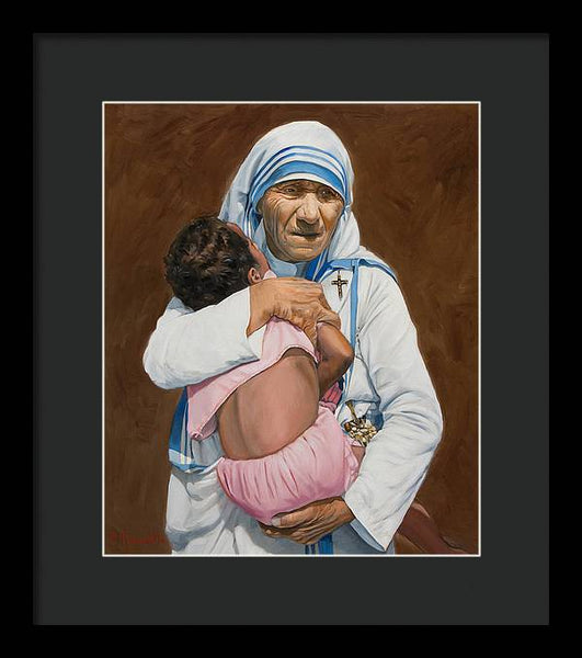 Mother Teresa holding a child - Framed Print