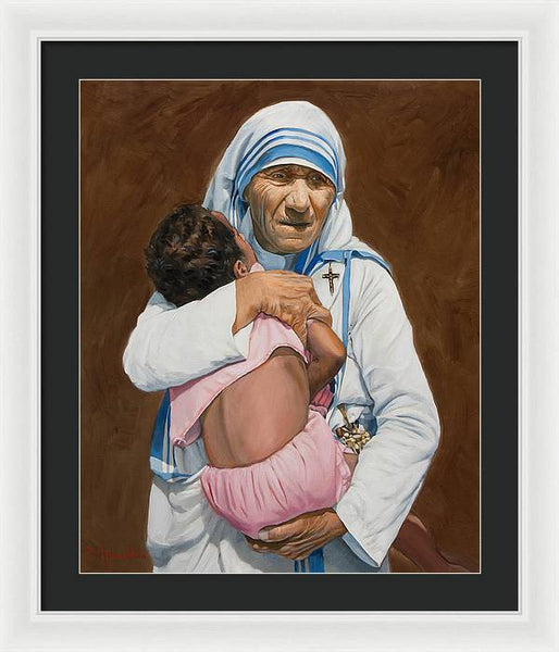 Mother Teresa holding a child - Framed Print