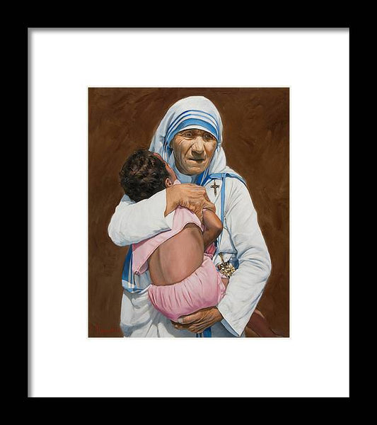 Mother Teresa holding a child - Framed Print