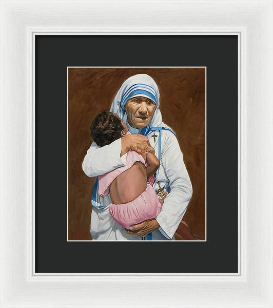 Mother Teresa holding a child - Framed Print